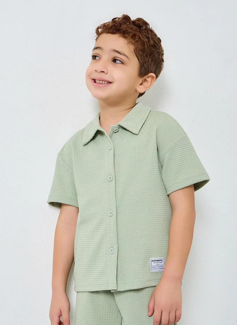 ستايلي مجموعة من شورت وقميص محبوك بنمط وافل